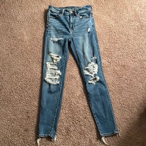 american eagle ripped blue jeans
